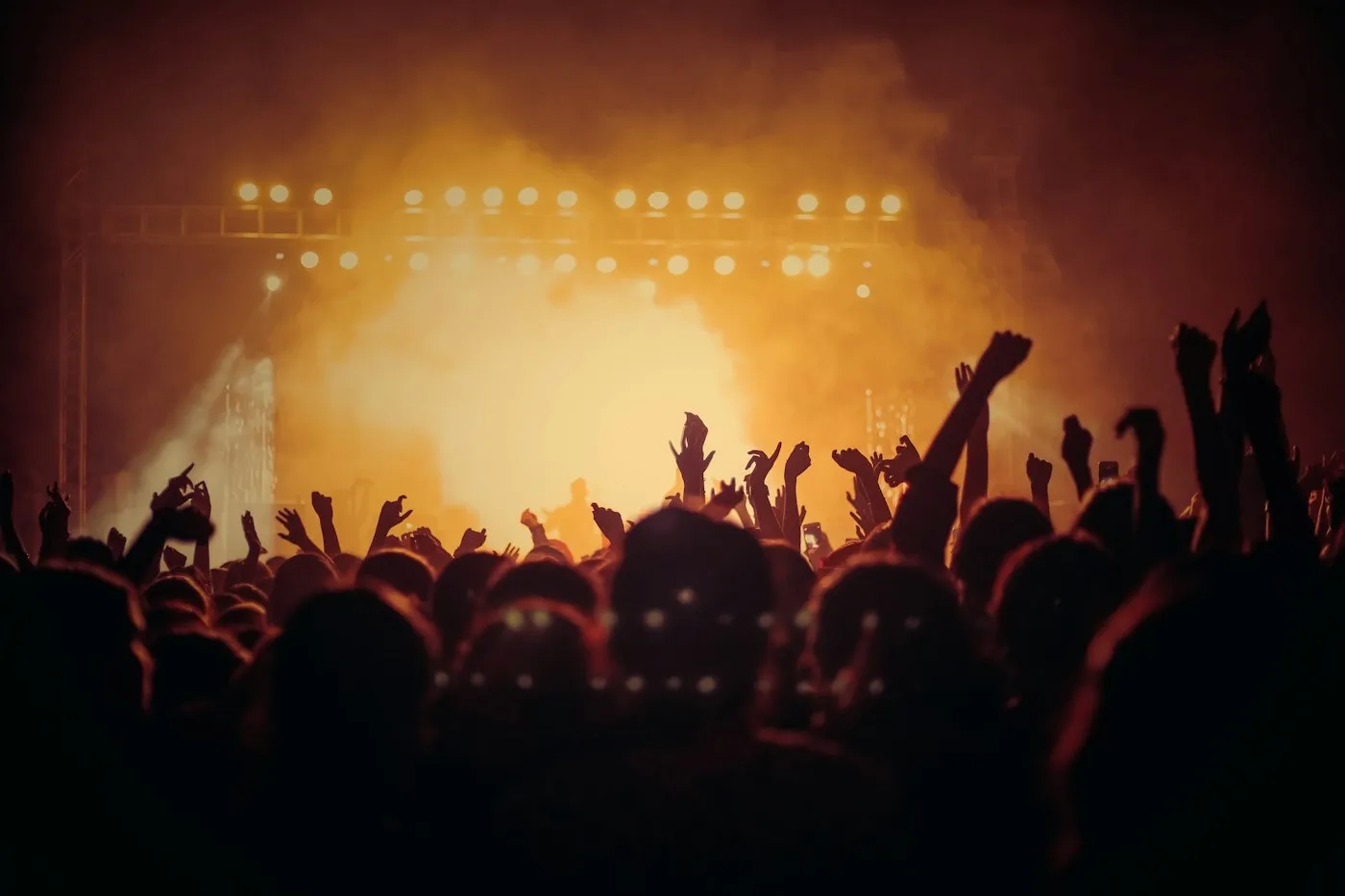Crowd with hands raised at a concert